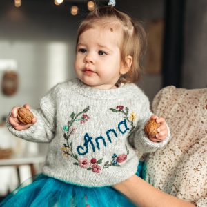 Baby sweater with name. Personalized wool sweater with flowers