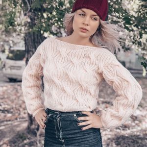 Knitted sweater for women with a lush pattern.