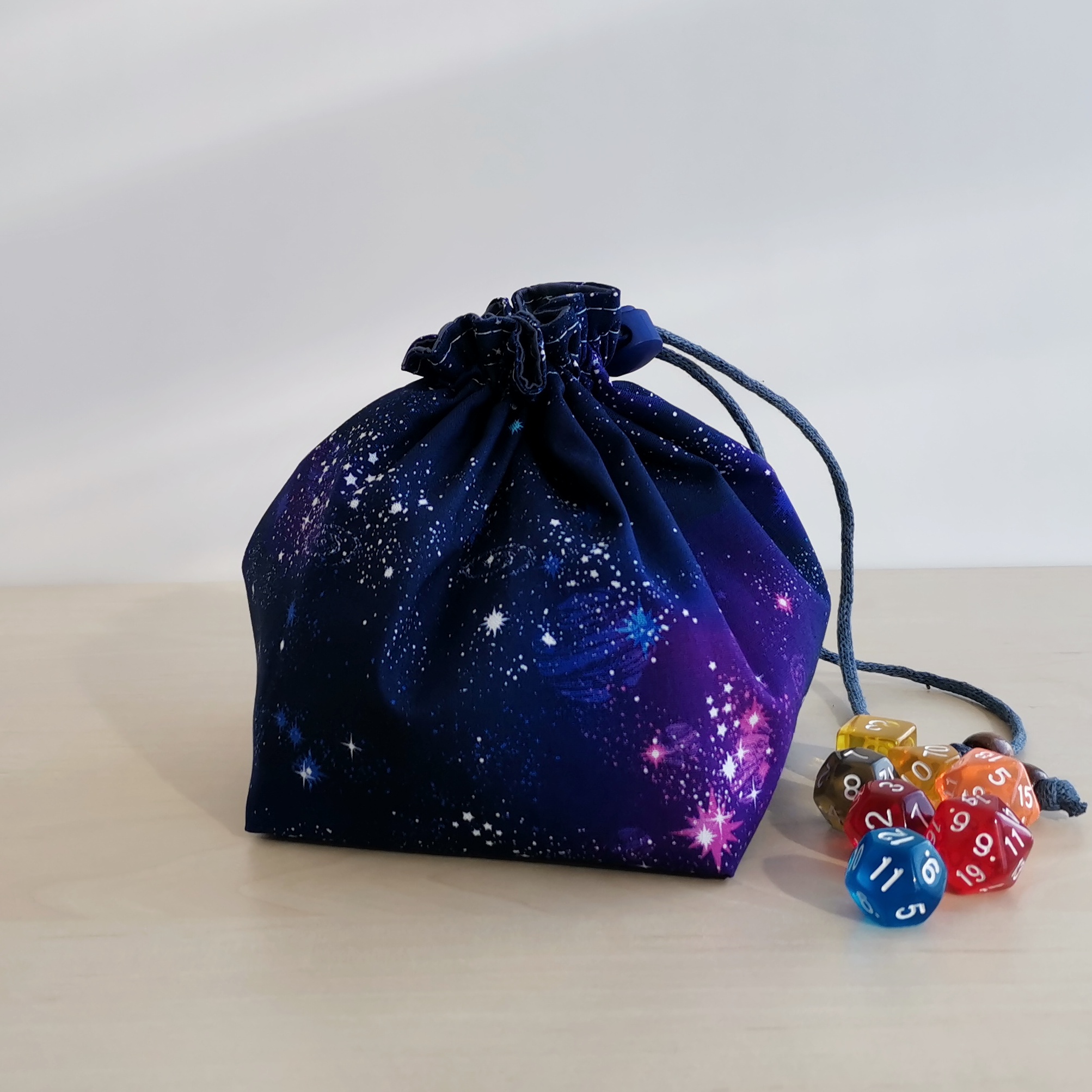 Large dice bag with pockets for 150-200 dice. Cotton fabric with galaxy print