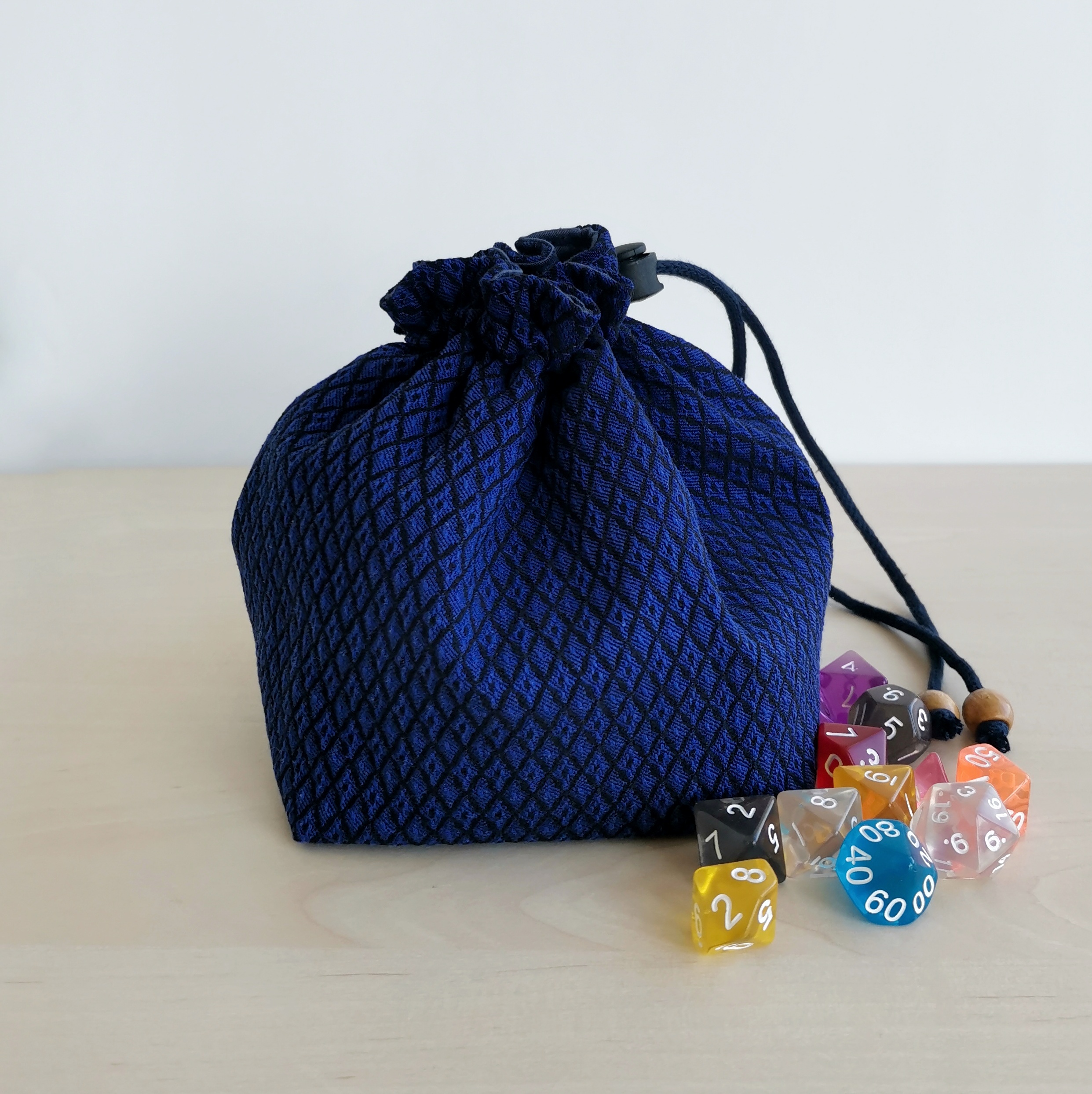 Blue jacquard dice bag with pockets