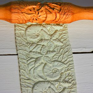 Rolling pin for dough and cookies with the image of the sea