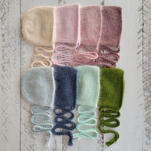Newborn fluffy footed romper and bonnet.