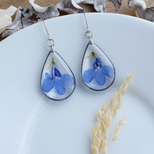Resin drop earrings with blue pressed flowers. Botanical earrings