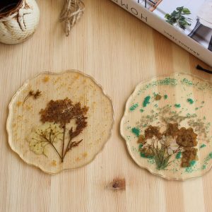 Coasters with field herbs