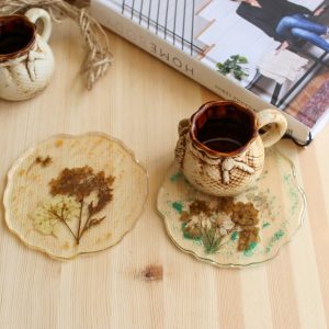 Coasters with field herbs