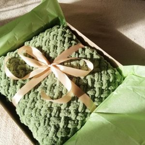 green blanket in box
