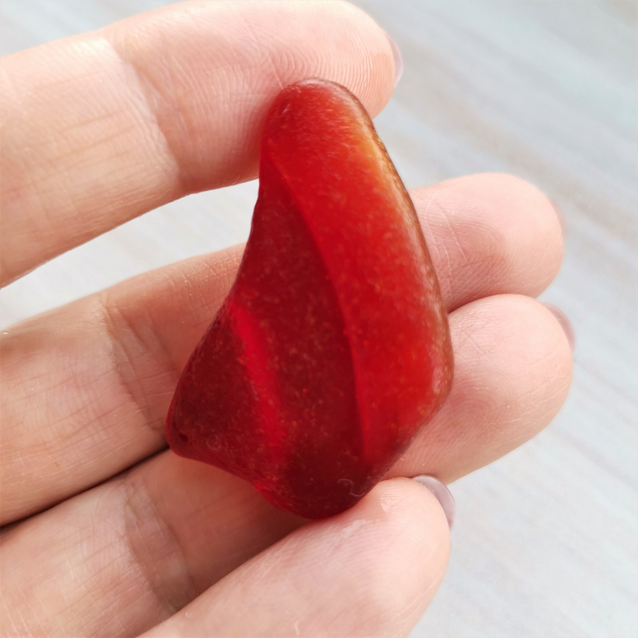 Ambergine red sea glass
