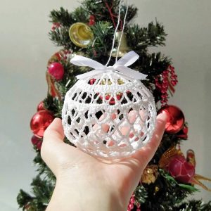 White Christmas ornament balls. These amazing crochet lace Christmas balls are made from natural thread, then blocked for to stand in a ball shape. You can see through their lacy design because there is no filling inside. Christmas balls 3d look great on Christmas tree or just in decorative plate on the table. Also Christmas baubles can make amazing Christmas gift for beloved person. 4 different colors available to pick from when placing your order.