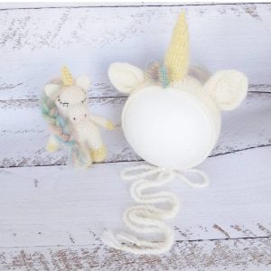 Unicorn newborn bonnet, stuffed toy, rainbow romper.
