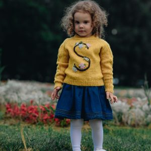 Knitted jumper with a letter for baby. Wool sweater with a name.