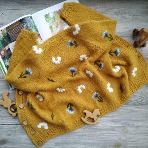 Handmade knitted cardigan with embroidered flowers for girl, baby