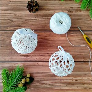 Crochet xmas ball patterns 2 designs includes detailed instructions with pictures of each step for additional help. Directions for starching the ornaments are also included. The tutorial contains US and UK crochet terms.
