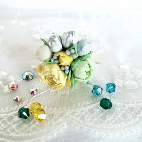 Handmade jewelry with miniature flowers of peonies in different colors. Can be as an addition to wedding accessories.