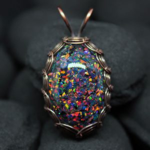 Dragon’s Egg opal pendant. Black laboratory opals in jewelry resin. Classic copper wire braid with patina. Mosaic wire wrap necklace