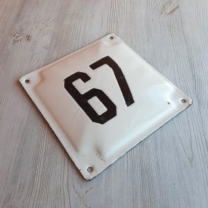 Old street number sign 67 house address plaque vintage