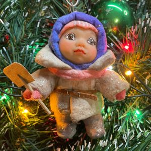 Christmas tree toy a boy with a baby spatula