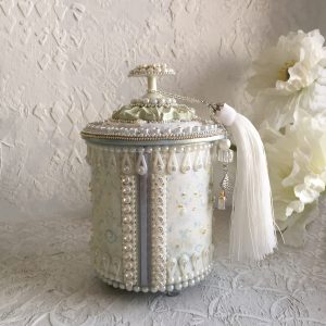 Round Delicate jewelry box, with a light mother-of-pearl tint on a beautiful 3d relief.