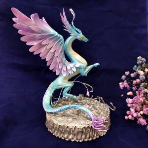 Dragon figure. View on blue background