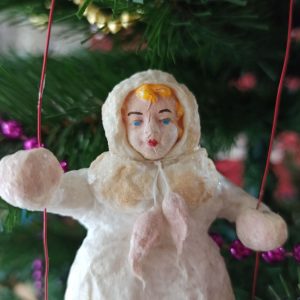 Christmas tree toy made of cotton wool Girl on a swing
