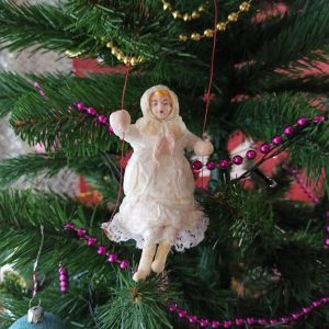 Christmas tree toy made of cotton wool Girl on a swing