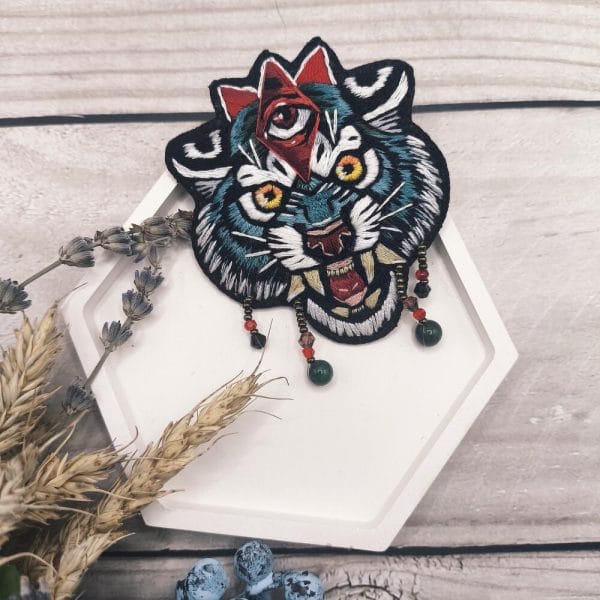 Handmade decoration brooch "Blue Tiger" in artistic satin stitch technique, front view