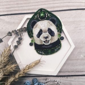 "Panda in a Crown" - embroidered brooch with the image of a panda bear in a beautiful green crown front view