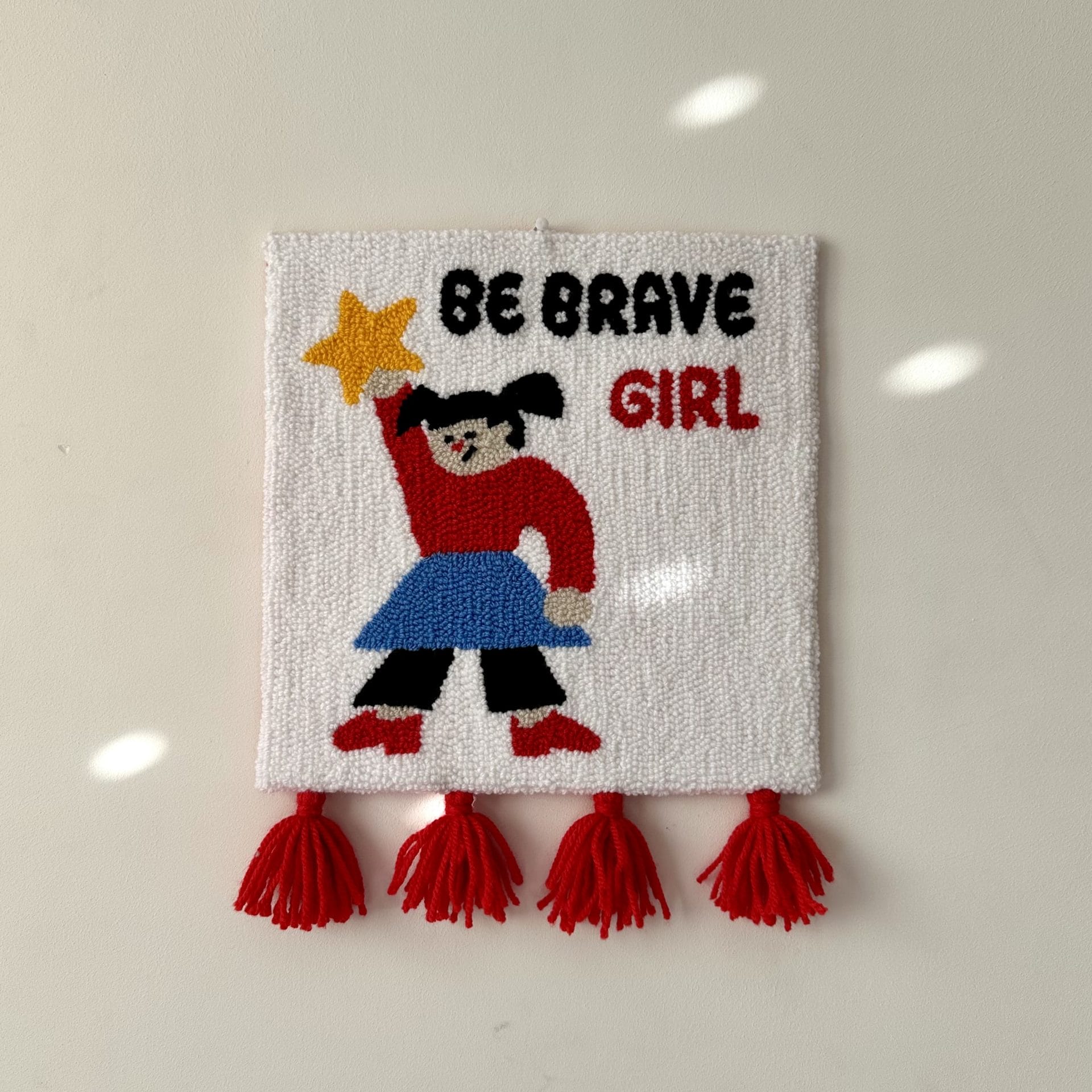 Punch Needle Wall Hanging “Be Brave Girl” Handmade Textile Art 1 Handmade punch needle wall hanging “Be Brave Girl” on neutral background