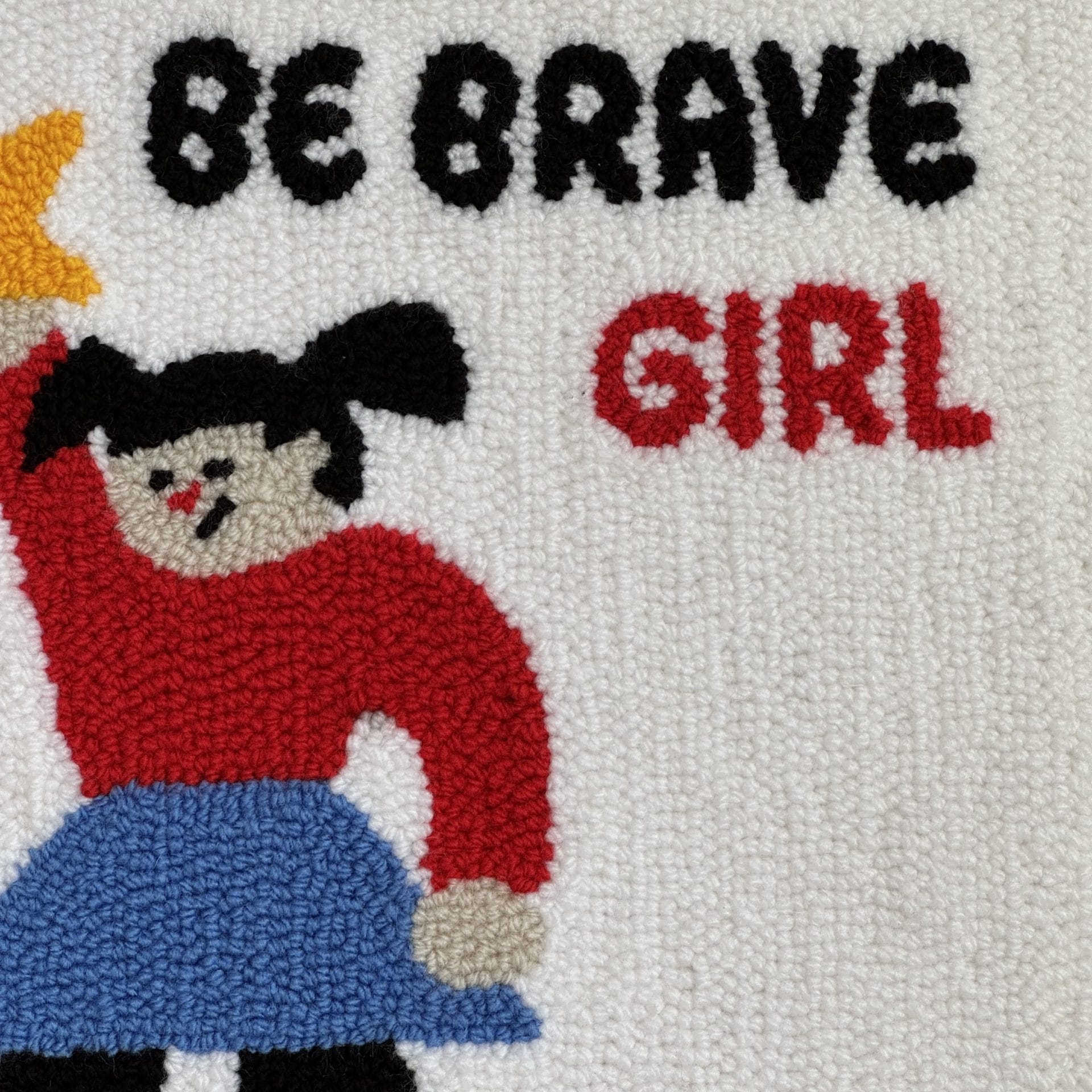 Punch Needle Wall Hanging “Be Brave Girl” Handmade Textile Art 3 Close-up of “Be Brave Girl” punch needle design showing text and girl illustration