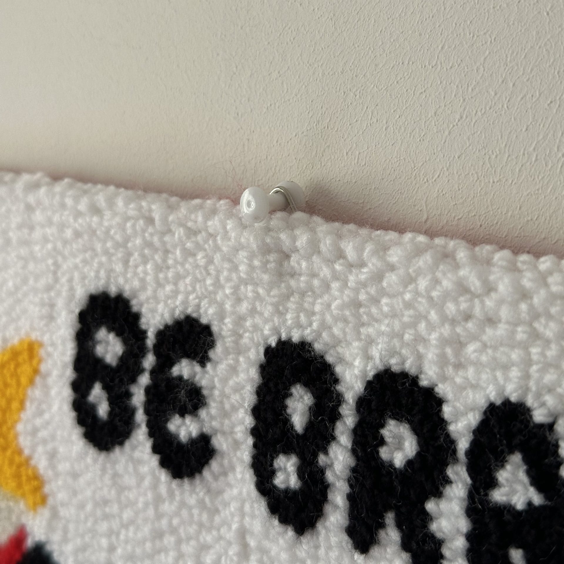 Punch Needle Wall Hanging “Be Brave Girl” Handmade Textile Art 11 Hanging detail of “Be Brave Girl” punch needle wall hanging displayed on wall