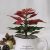 Holiday arrangement with faux flowers in vase