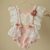 6-12 month girl romper in pale pink and white colours. Baby photo prop