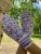 Women’s hand-knitted wool mittens are very warm with a pattern