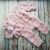 A romper with “bubbles” and a bunny toy (color dusty rose)