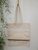 Strong reusable beige tote bag, cotton canvas bag with a pocket