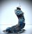 Sculptural art made of driftwood. Fishermen in a stormy sea.