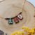 Cottagecore necklace with letter, house and alocasia houseplant
