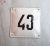 Old Soviet address number plate 43 – vintage house number sign white black