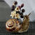 1 Unusual snail, realistic flower arrangement as a gift.